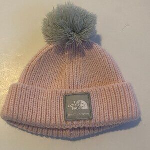The North Face, baby girl, baby pink knit beanie with grey pom pom**XXS 0-6 M.